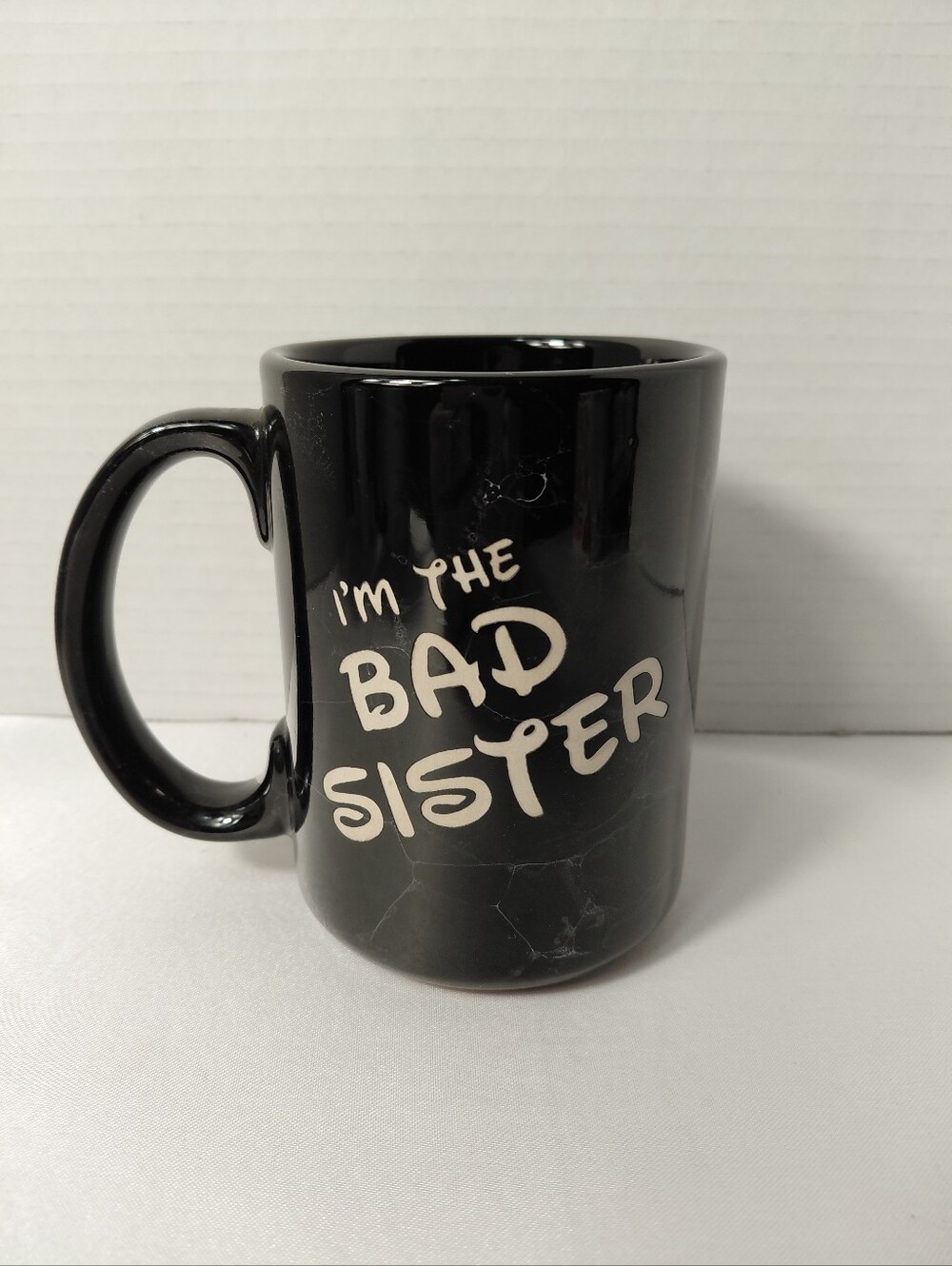 Black "I'm The Bad Sister" Ceramic Mug